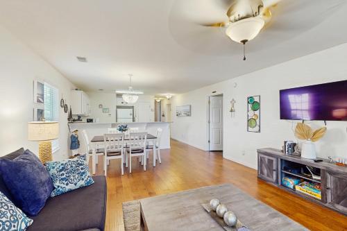 a living room with a couch and a table at Haven On The Links in Pawleys Island