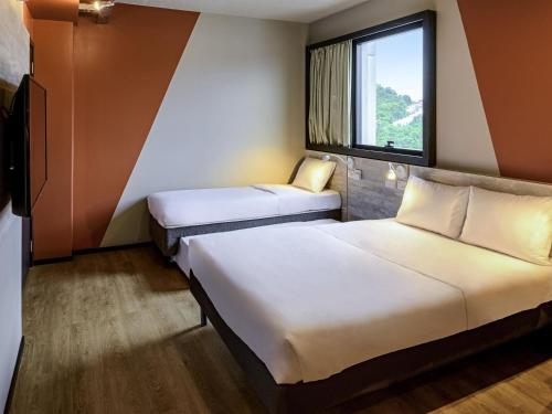 Katil atau katil-katil dalam bilik di Ibis Budget Balneario Camboriu