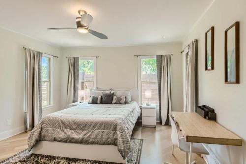 a bedroom with a bed and a ceiling fan at Mid Century Cozy & Quiet Home-Walk to the Square in Georgetown
