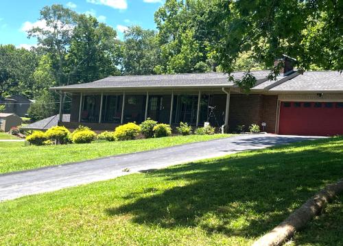 a house with a driveway in front of it at The Downer House in Chattanooga