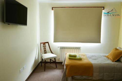 Postel nebo postele na pokoji v ubytování Los Lagos Hotel