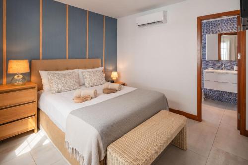 a bedroom with a large white bed and a window at VILLA ALAY by Buenavilla in Playa Blanca