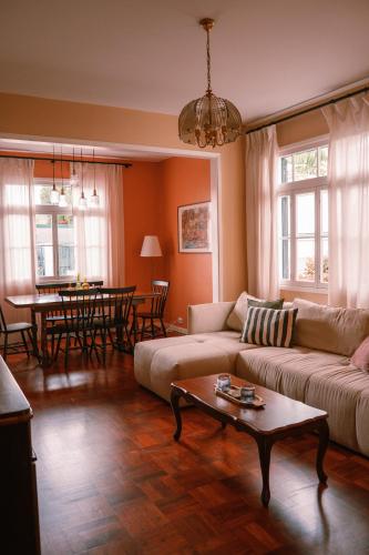 a living room with a couch and a table at Casa d'Avo - 3BD cosy home in Funchal