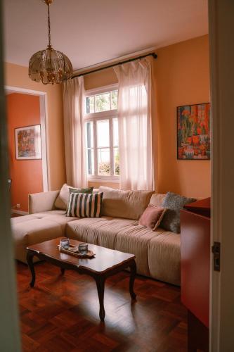 a living room with a couch and a coffee table at Casa d'Avo - 3BD cosy home in Funchal
