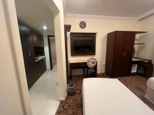 Ένα ή περισσότερα κρεβάτια σε δωμάτιο στο Al Bilad 1 Hotel Makkah by Moro