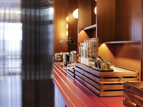 a counter with many items on it in a room at ibis budget Münster City in Münster