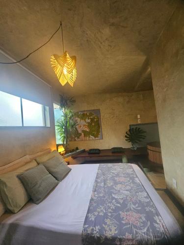 a bedroom with a large bed in a room at Espaço Spa in São Paulo