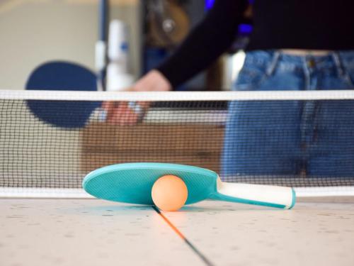 a skateboard sitting on the floor in front of a net at ibis Budget Millau Viaduc in Millau