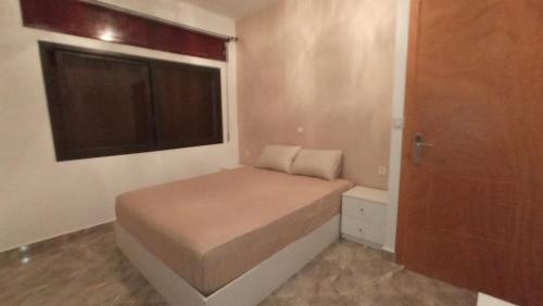 Postel nebo postele na pokoji v ubytování capuchino sanya