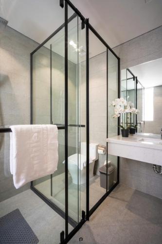 a bathroom with a toilet and a sink and a mirror at TS Villa in Danang