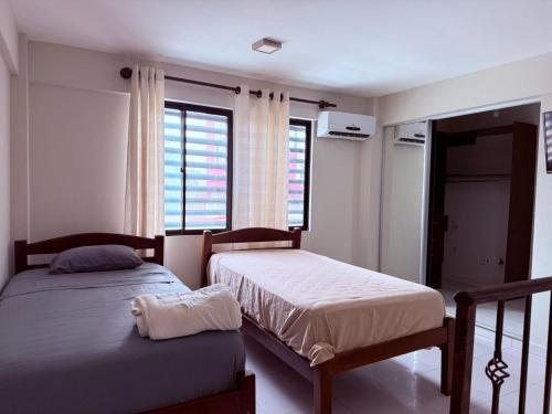 Katil atau katil-katil dalam bilik di Hospedaje Zea Feria Fexpocruz