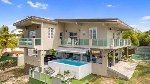 an aerial view of a house with a swimming pool at Las Palmas Beach House with Private Pool and Pool Table in Ensenada