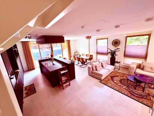 a living room with a couch and a table at Spectacular 3Floor Town House Nearby CityCenter in Rotterdam