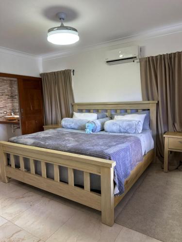 a bedroom with a large wooden bed in a room at Villa Valentina 