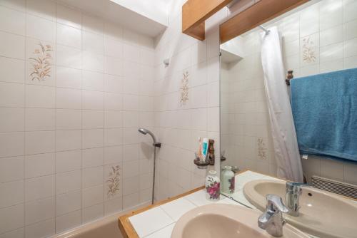 a bathroom with a sink and a bath tub at Face au Mont Blanc, plein sud in Cordon