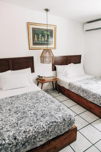 Katil atau katil-katil dalam bilik di Cinco Hotel B&B