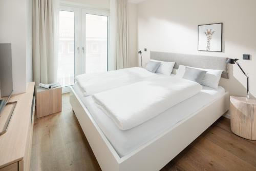 Ένα ή περισσότερα κρεβάτια σε δωμάτιο στο meer suite juist 6 - mit Wattblick
