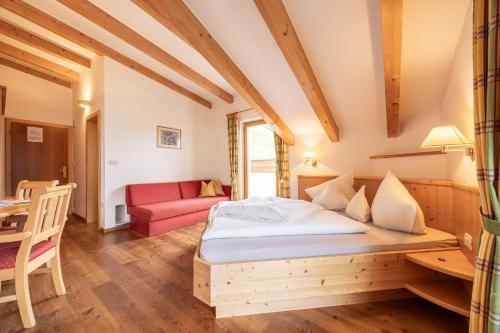 Postel nebo postele na pokoji v ubytování Hotel Garni Alpes
