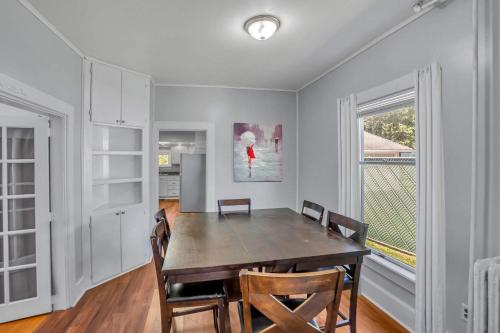 a dining room with a table and chairs at The Wheelhouse All Star Baseball Rentals in Oneonta