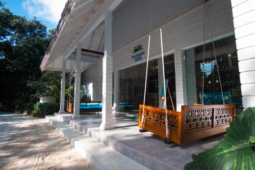 a store front with a porch with a swing at Ifuru Island Maldives - FREE Return Domestic Flight for 2 with a minimum 5-night stay until Nov 2025 in Raa Atoll