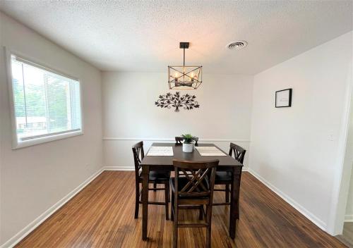 a dining room with a table and chairs at The Hilltop in Center Point