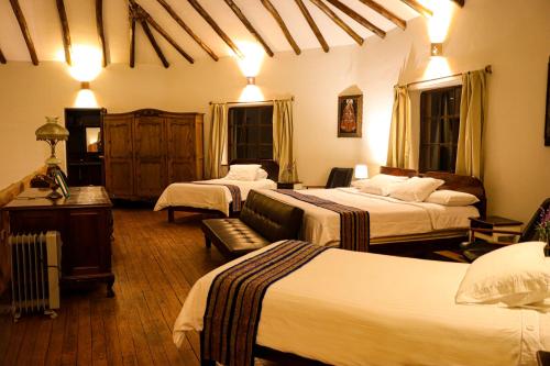 Una cama o camas en una habitación de Andean Wings Valley