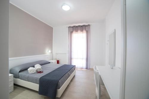 Кровать или кровати в номере Raggio Di Sale