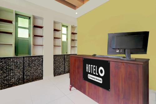 TV a/nebo společenská místnost v ubytování Hotel O Chalakkudy River Annamanada Svasthya Retreat
