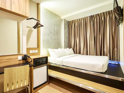 Postel nebo postele na pokoji v ubytování ibis budget Singapore West Coast