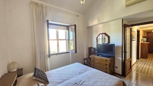 Katil atau katil-katil dalam bilik di Casa Bianca Villaputzu