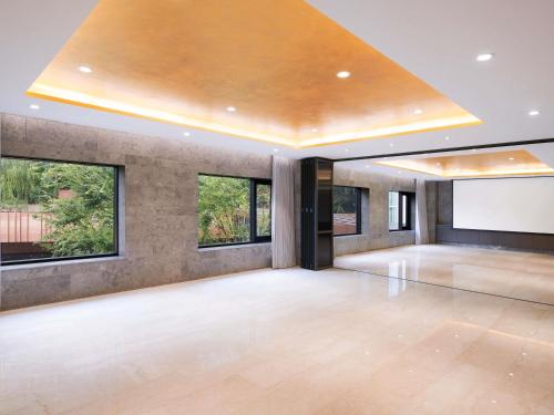 a large ballroom with a dance floor and windows at Mondrian Seoul Itaewon in Seoul