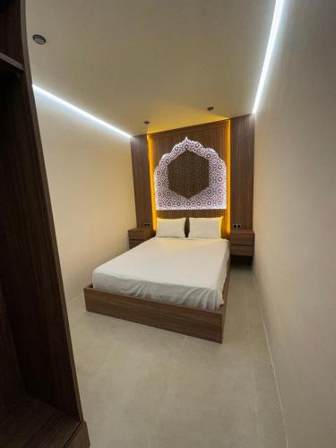 a bedroom with a bed with a head board at STUDIO HIGH LuX 01 in Tangier