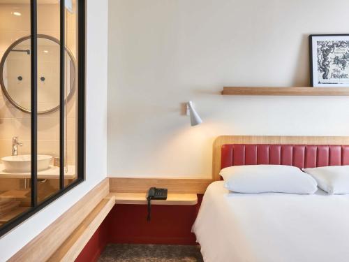 Ένα ή περισσότερα κρεβάτια σε δωμάτιο στο ibis Styles La Roche-sur-Yon