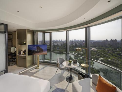 a hotel room with a view of the city at Novotel Shanghai Caohejing in Shanghai