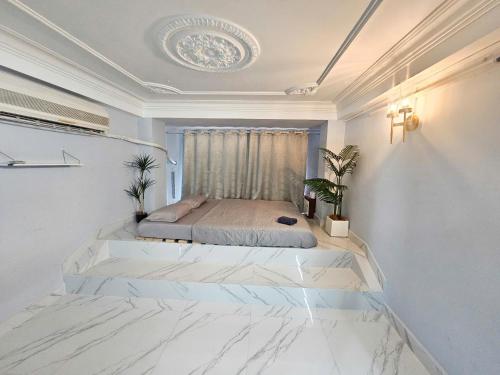 En eller flere senge i et værelse på H2T Hotel Vip