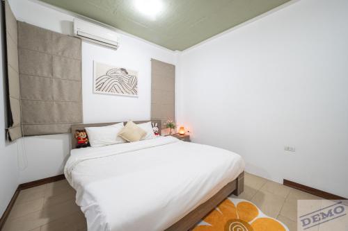 a bedroom with a large white bed in a room at Tu Hoa Hotel by Luxe Hospitality in Hanoi