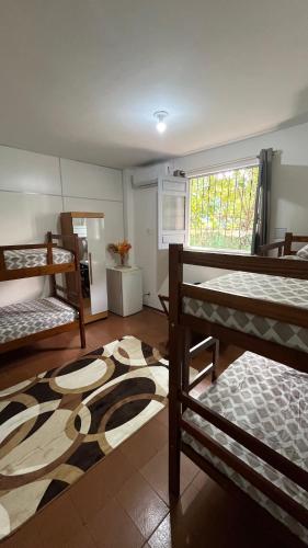 Llit o llits en una habitació de Quartos Largo da 16 COP 30