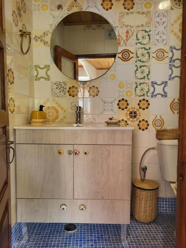 a bathroom with a sink and a mirror at Charming Studio apartment in Sintra, Penedo in Colares