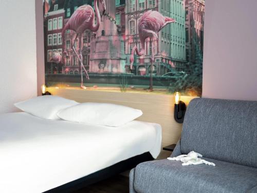 ibis Styles Lille Neuville en Ferrainにあるベッド