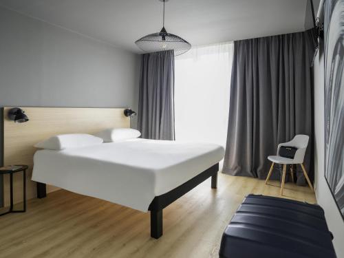 ibis Styles Lille Neuville en Ferrainにあるベッド