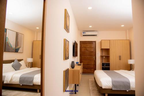 Ένα ή περισσότερα κρεβάτια σε δωμάτιο στο Amani inn hotel