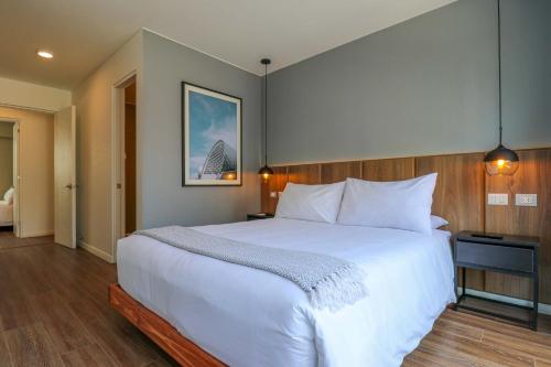 Voodi või voodid majutusasutuse Actual by Wynwood House toas