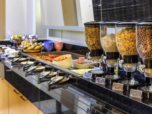 a buffet with many different types of food on a table at ibis Styles Belém do Pará in Belém