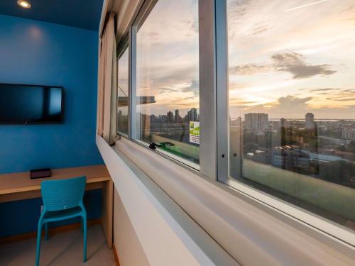 Ibis Styles Belém Hangarにあるテレビまたはエンターテインメントセンター
