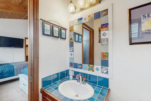 a bathroom with a sink and a mirror at Ocean Star in Sea Ranch