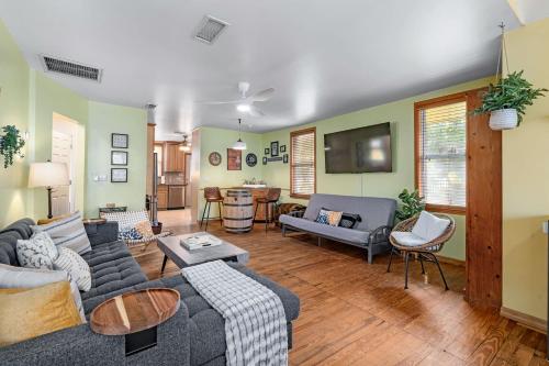 a living room with a couch and a table at Downtown Gem- Dog Friendly Walk to Everything in St. Augustine