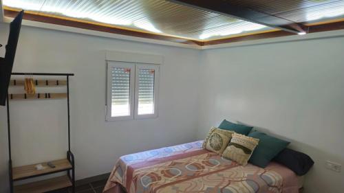 Postel nebo postele na pokoji v ubytování Optimus Studio Esturión