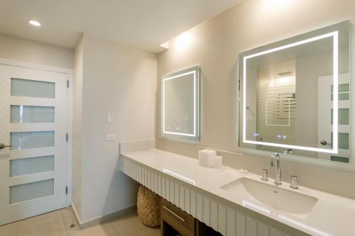 a bathroom with a sink and a mirror at Hyatt Regency Grand Reserve Puerto Rico in Rio Grande