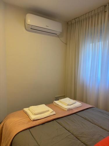 Ένα ή περισσότερα κρεβάτια σε δωμάτιο στο Bnb Loft IV