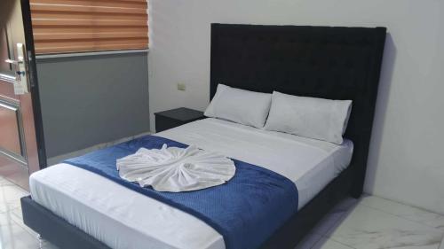 Кровать или кровати в номере hostal el paraiso